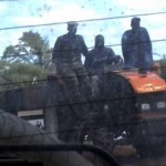 Report Cover Photo: Soldiers driving a tractor Report Cover Photo: Soldiers driving a tractor