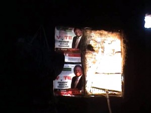 Report Cover Photo: In a brave act of defiance, posters of Morgan Tsvangirai hang on the wall of a hut burnt by ZANU PF supporters in Shamva, April 2008