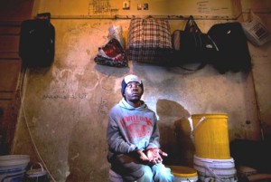 Report Cover Photo: Blind Zimbabwean in the room he shares with other blind friends in Johannesburg