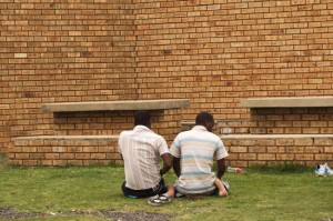 Relatives pray outside after visiting detainees inside Lindela Detention Centre, Krugersdorp, South Africa